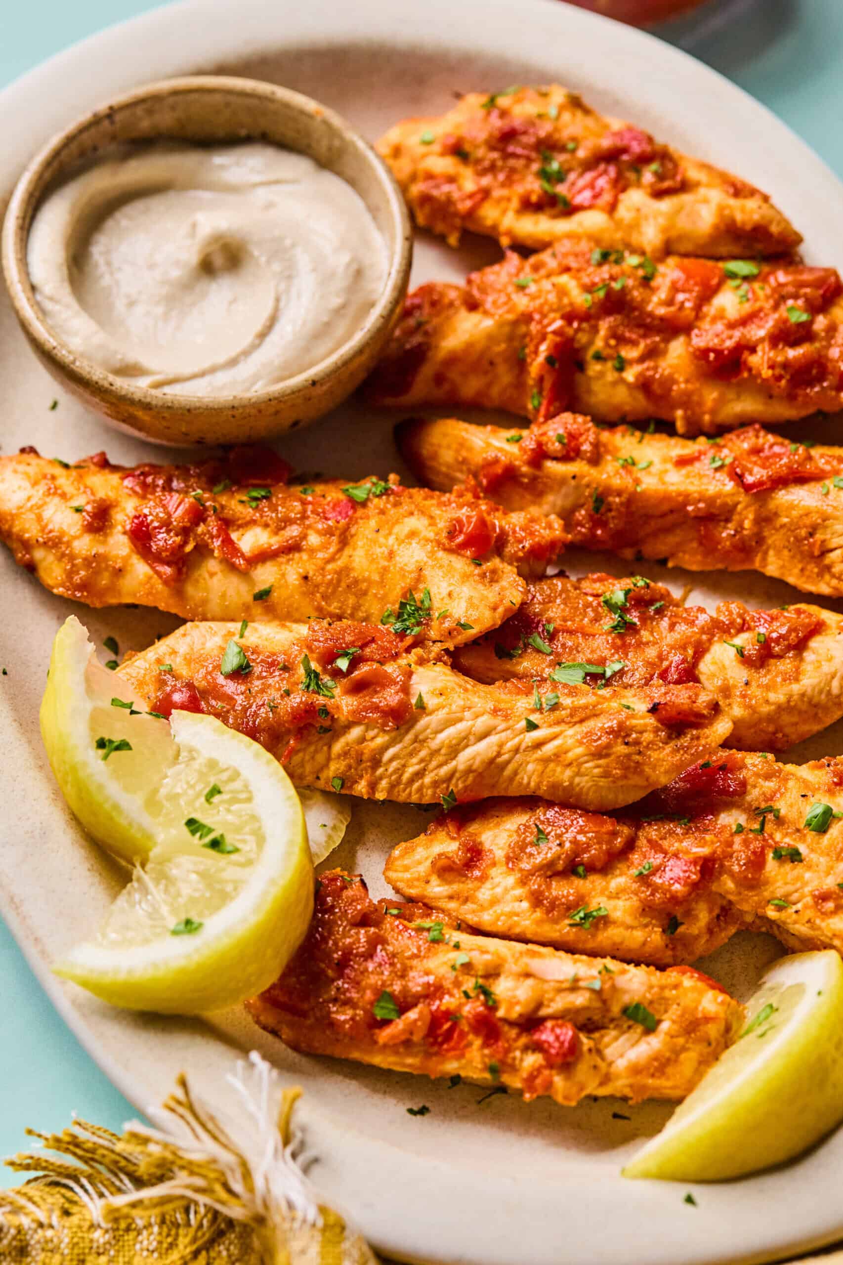 Harrisa Chicken Strips with Creamy Tahini Yogurt Sauce